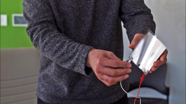 A paper-thin loudspeaker plays "We Are the Champions" by Queen