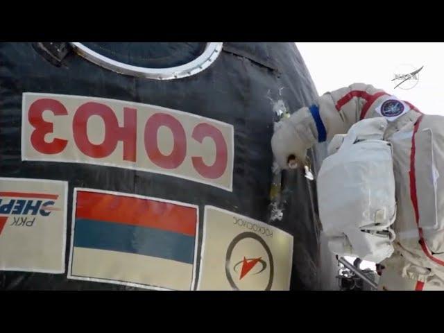 Watch a Spacewalking Cosmonaut Take a Knife to Soyuz Capsule