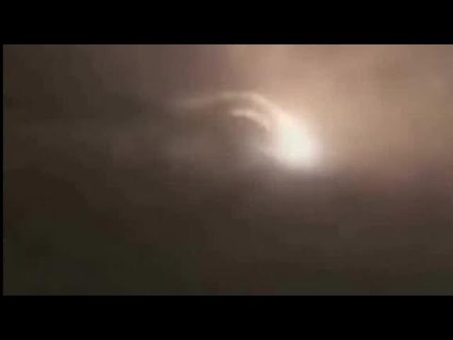 Flaming spinning wheel caught on video at dawn in the skies over Santa Fe