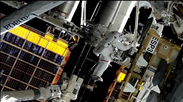 Spacewalkers install rollout solar array outside space station