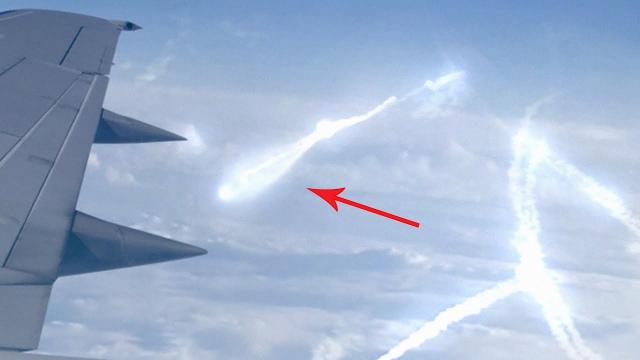 A passenger on an airplane has filmed a strange object hovering in the sky!