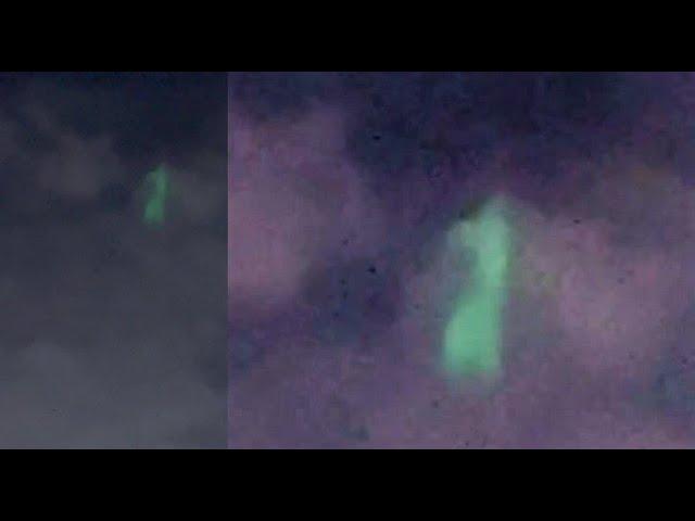 Huge glowing green UFO filmed between clouds over Pembroke Pines, Florida