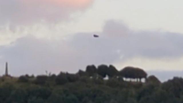 Strange Black Triangular Shaped UFO Sighted Over Werneth Low Hill In Manchester, England (UK)