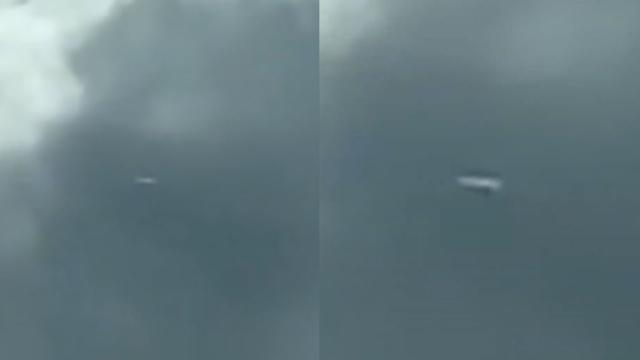 Large Cigar Shaped UFO Vanishes Into Cloud over Asheville, North Carolina (US)