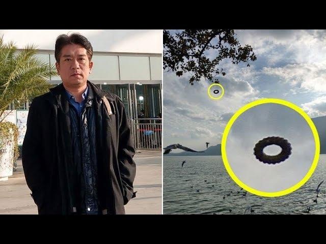 Tourist spots mysterious 'doughnut' UFO hovering over lake in picture that has experts stumped