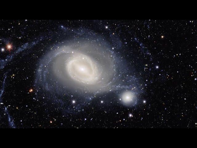 Spiral galaxy 'arm' wraps around companion in amazing imagery
