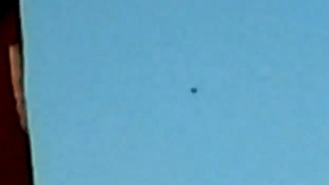 Black Circular UFO Hovering Slowly above Houses in Reutlingen, Germany - FindingUFO