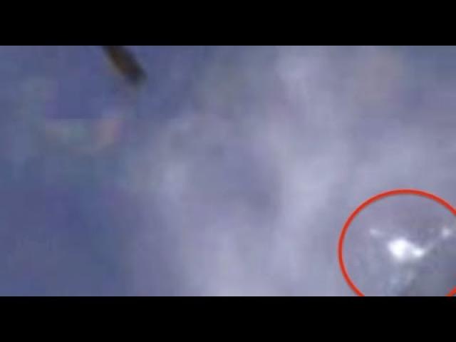 White UFO Following Shuttle Atlantis Rocket, STS115