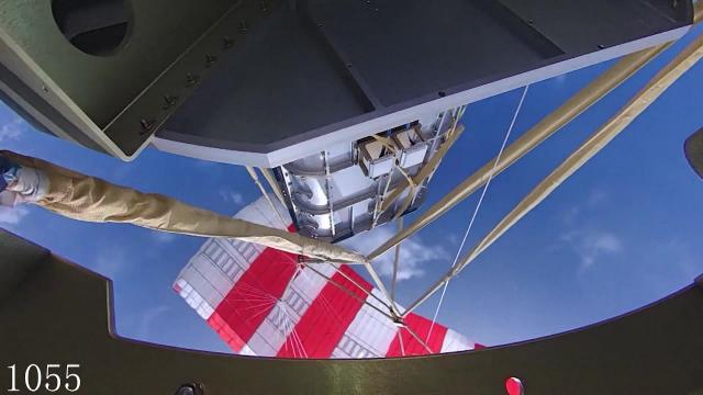 See a Chinese rocket booster's parachute system in action for controlled landing