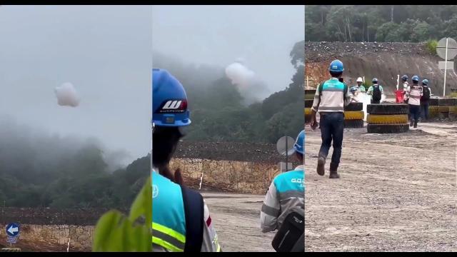 The sky is falling, strange cloud falls from the sky in front of road workers