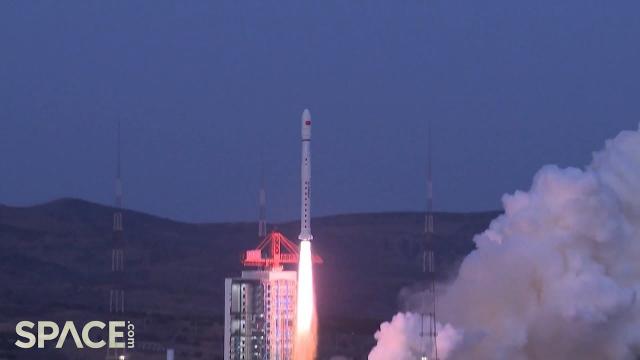 China's launches mysterious twin satellites, rocket sheds tiles