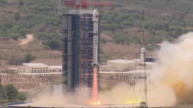 Blastoff! China's Long March 2B launches 41 satellites, rocket sheds tiles