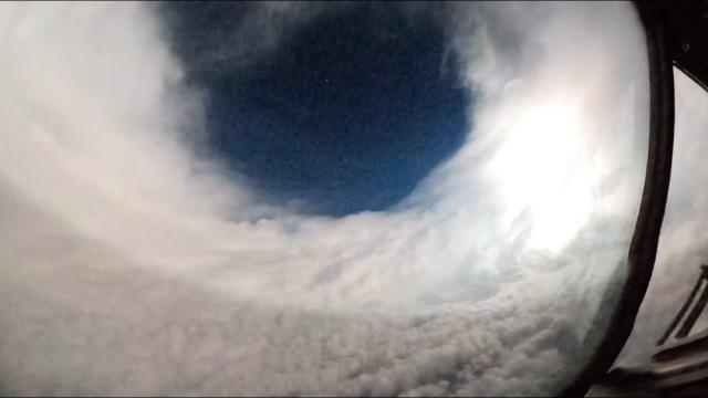 Hurricane Lee's eye lit up by lightning in ominous view from plane