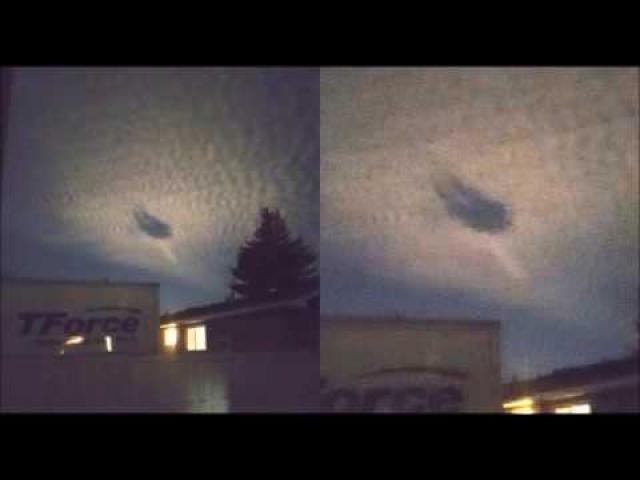 Huge UFO cloaked in the clouds, caught on camera over Calgary, Canada