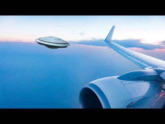 A US military woman recorded this video of a UFO from an airplane window
