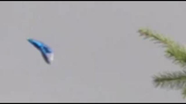 Blue 'TR 3B triangle UFO' filmed in broad daylight over London, UK