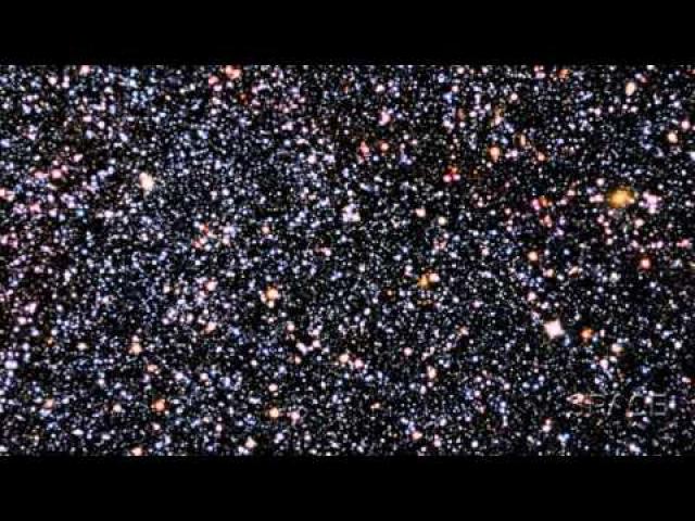 Dwarf Galaxy, Hiding In Plain Sight, Frames Distant Large Galaxies | Video