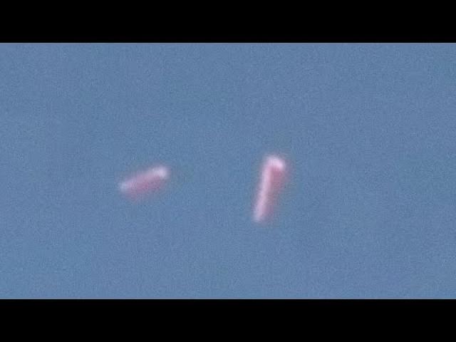 Cigar-shaped UFO separating in Two Objects ????