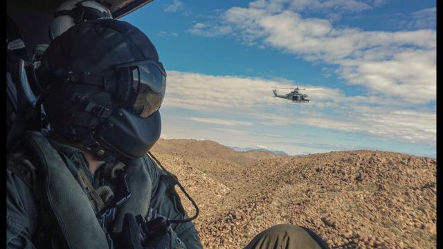 Helicopters surround a UFO south of Las Vegas at 12286 Pahrump Vly Hwy