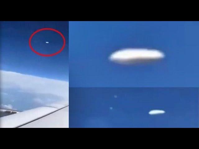 Bright elongated UFO releases orbs filmed by plane passenger