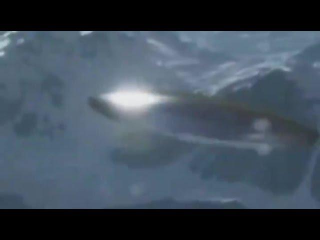 Military Helicopter Filmed this Disc-Shaped Silver UFO in Sakhalin Island