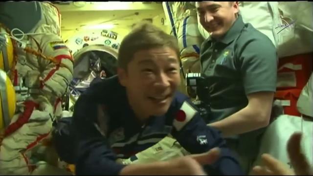 Hatch open! Japanese billionaire enters space station with crew