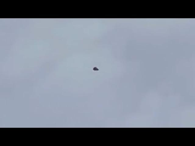Black Triangular Shaped UFO Hovering Motionless over Islamabad in Pakistan