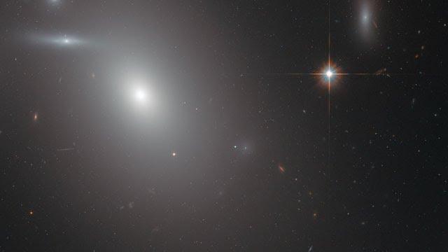 Panning across the elliptical galaxy NGC 4889