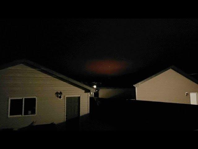 Strange glowing red light in clouds over Alberta, Canada