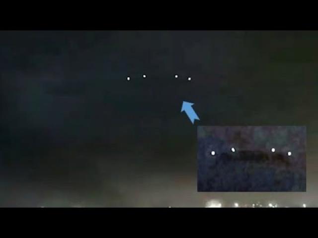Huge UFO is stationed over the city of Barcelona during a thunderstorm