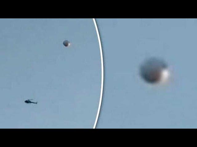 LOS ANGELES, Police Helicopter intercepts a UFO stopped in the sky !!