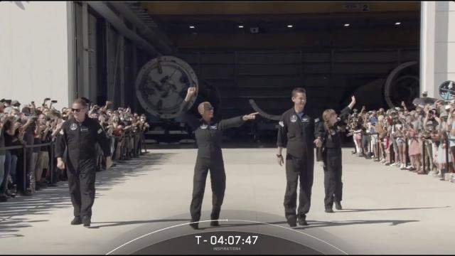 Inspiration4 crew walks out of SpaceX's Hanger X to prepare for launch