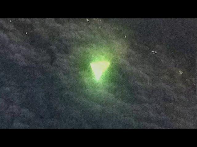 Triangular UFO photographed by an airplane passenger over Texas