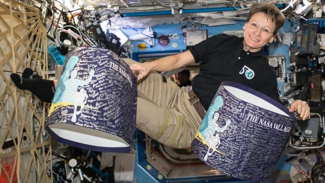 NASA Village signatures fly with me on the International Space Station.