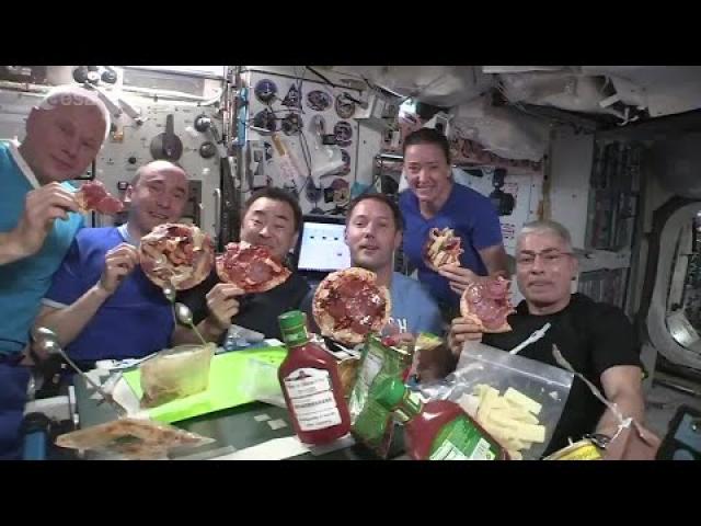 Astronauts have a pizza party in space
