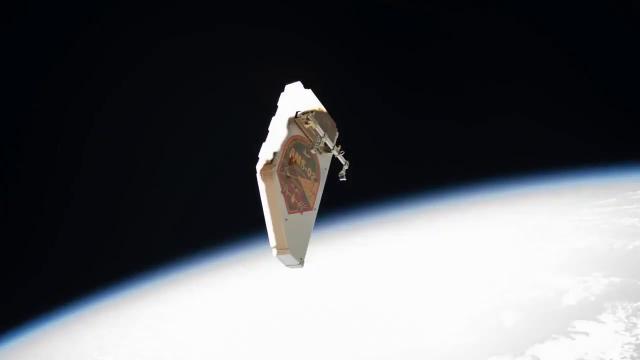 Watch Spacewalker Toss Debris Shield Away from Space Station