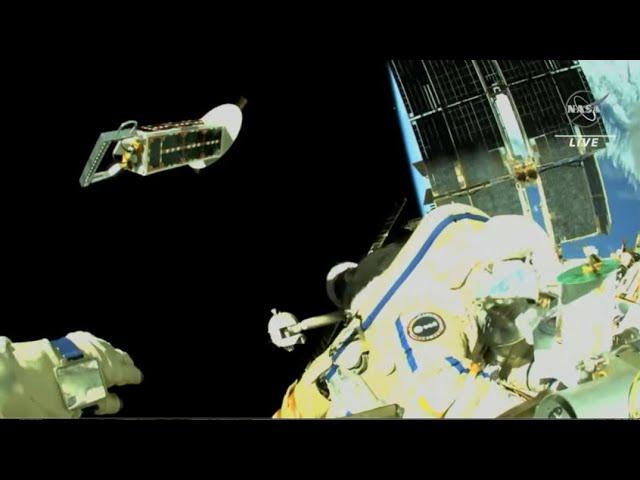 Spacewalker tosses cubesats away from space station in this amazing view