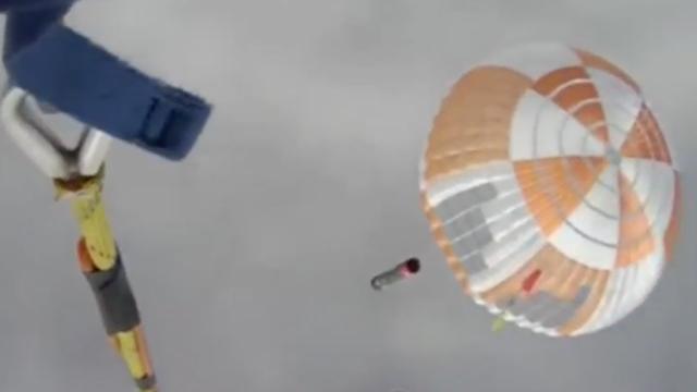 Rocket Lab launches 34 satellites, helicopter catches booster for 1st time!