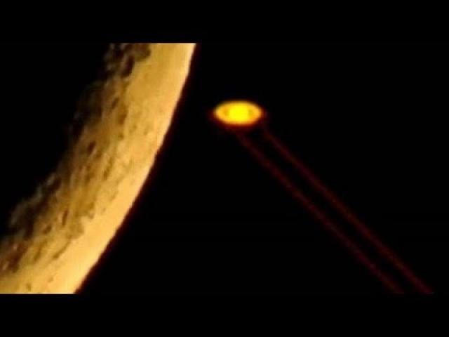 Unknown laser beams being fired from Saturn into deep space!