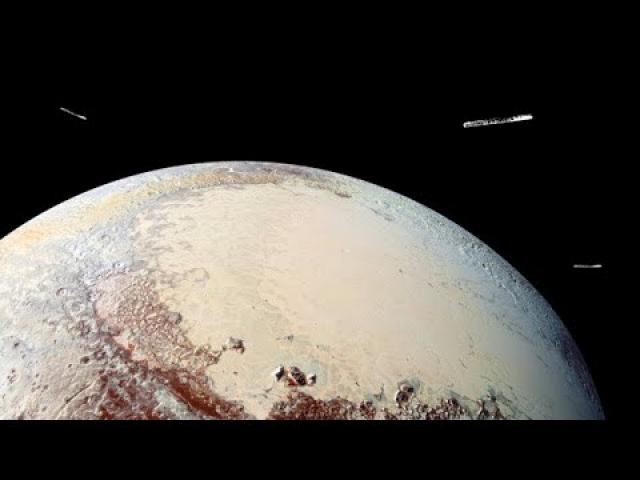 Were Large UFOs Seen Surrounding Pluto?