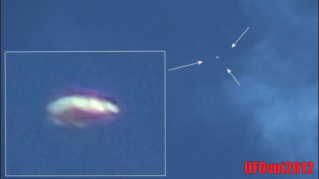 Silver Metallic Disc Shaped UFO observed during Houston Air Show