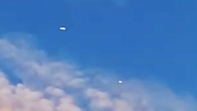 Two Glowing Cigar Capsule Shaped UFOs Flying in Straight Path over Louisville, Kentucky