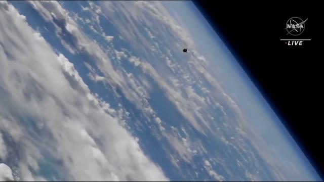 Crewed soyuz approaches space station in stunning over Earth view