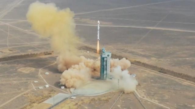 Chinese rocket launches a Yaogan-34 satellite & sheds tiles in awesome drone view