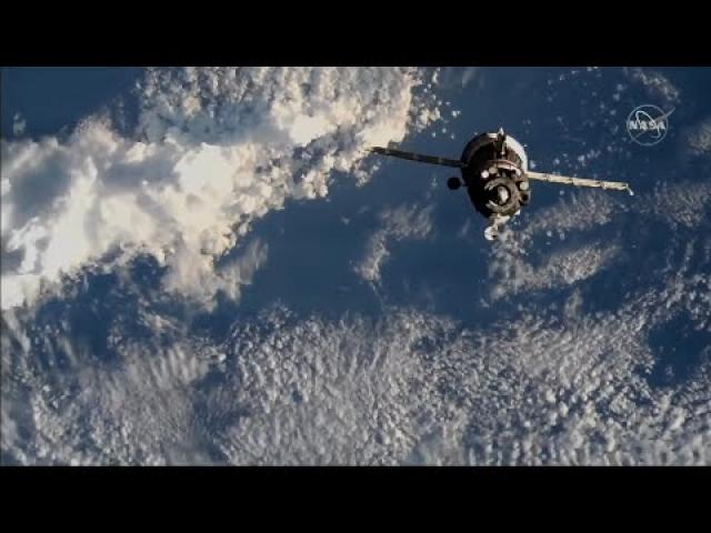 Soyuz docks to space station with NASA astronaut and 2 cosmonauts aboard