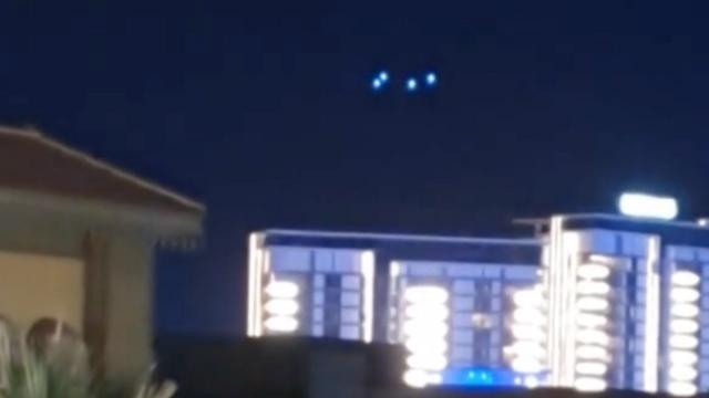 Four Strange Orb Glowing UFOs Filmed Hovering and Disappearing above Hotel in Dubai