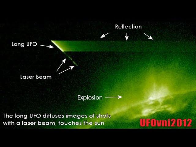 The Long UFO Diffuses Images Of Shots With A Laser Beam, Touches The Sun