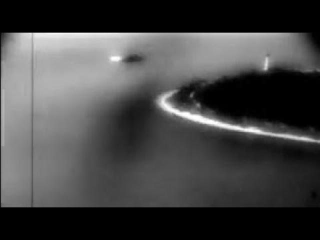 This WWII video shows a UFO flying over an island along with planes approaching the runway