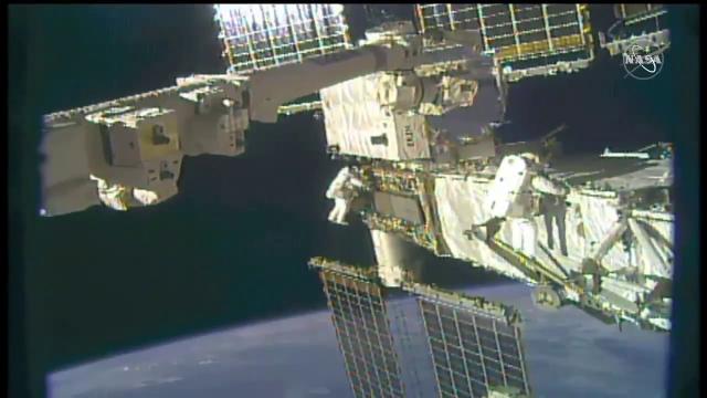 See NASA spacewalkers working outside space station to swap batteries