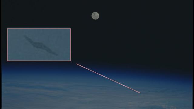 Black lightning bolt UFO Seen From Space Shuttle Discovery